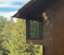 side view of rusted steel studio in deep north woods